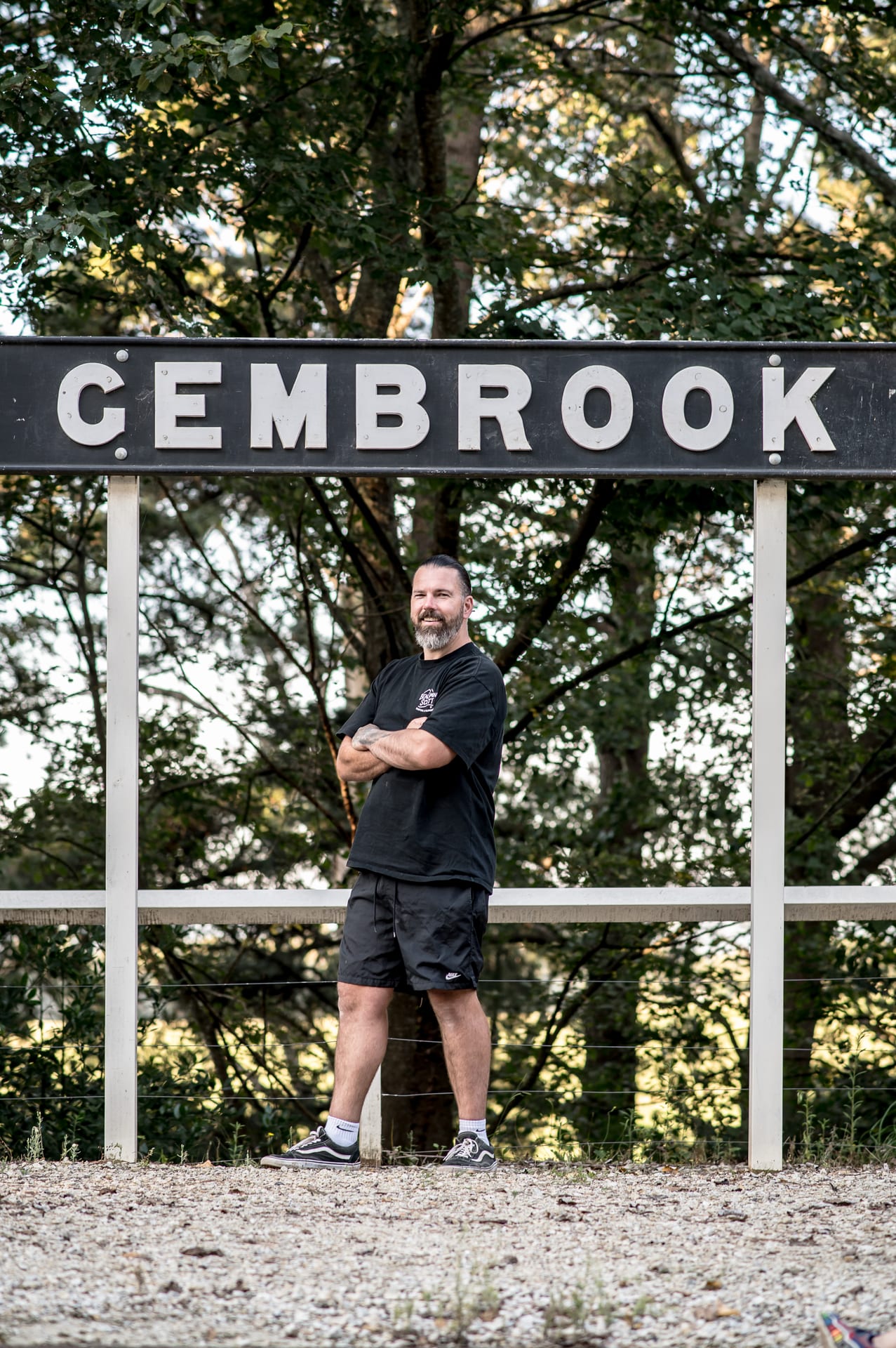 Ben Scott in front of Gembrook sign